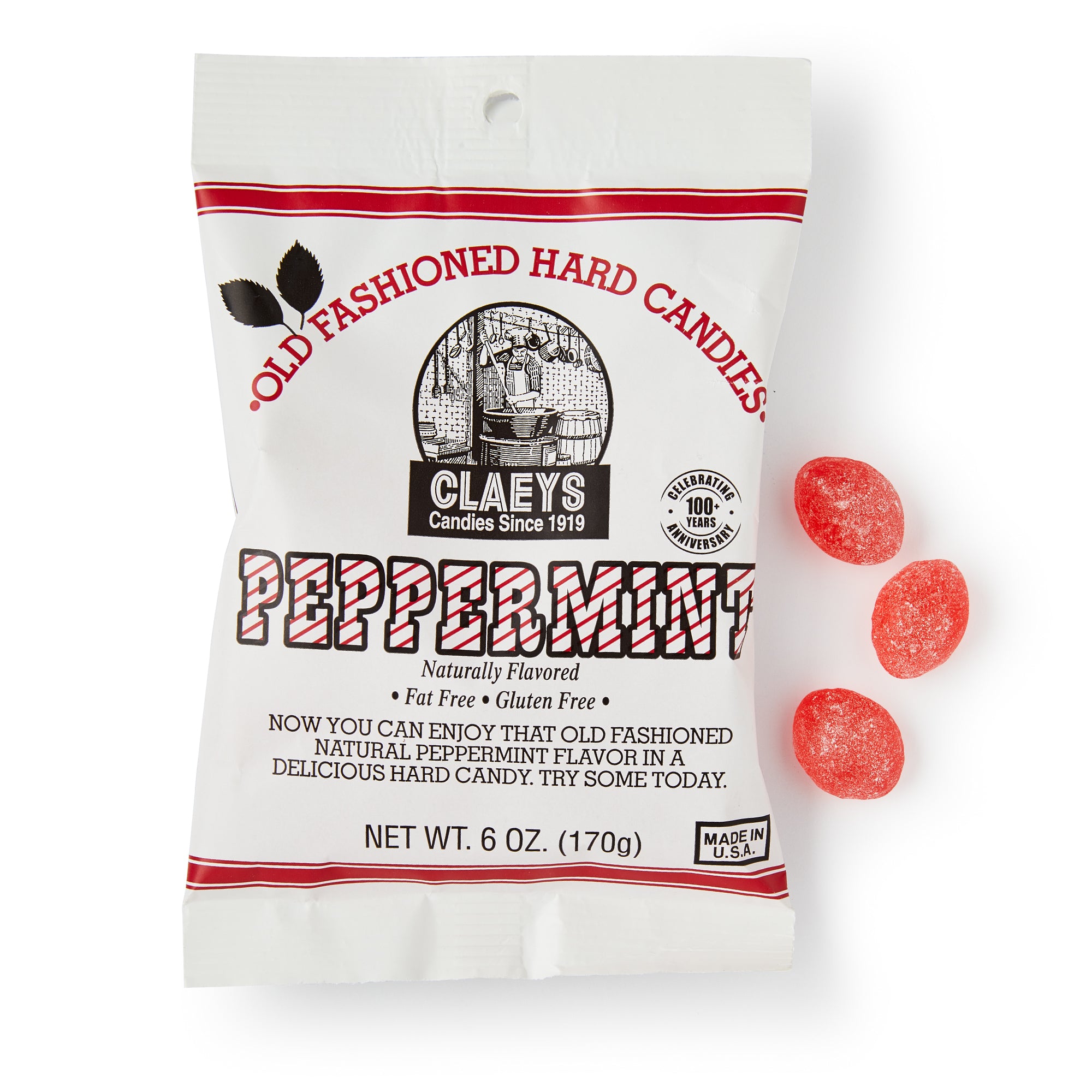 A white bag of Peppermint Old Fashioned Hard Candies, labeled fat-free and gluten-free, sits beside three peppermint candies. The 6 oz (170g) package contains classic peppermint flavor.