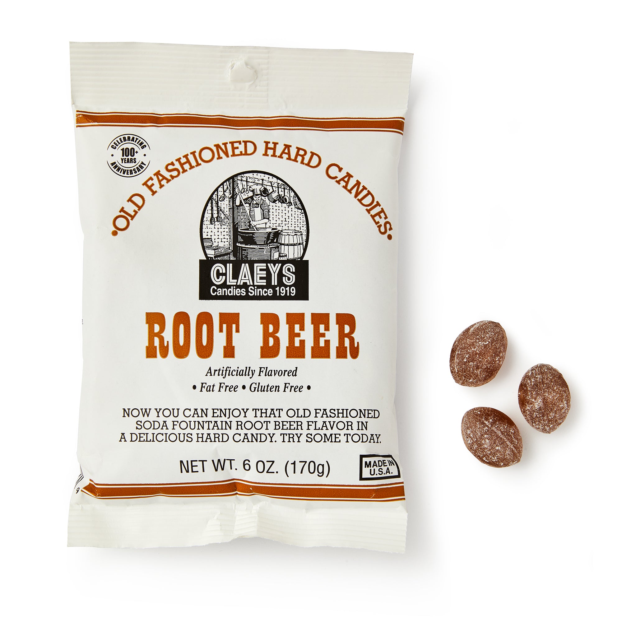 A bag of Root Beer Old Fashioned Hard Candies features root beer flavored ovals and comes in white vintage-style packaging with brown and orange text and classic graphics.