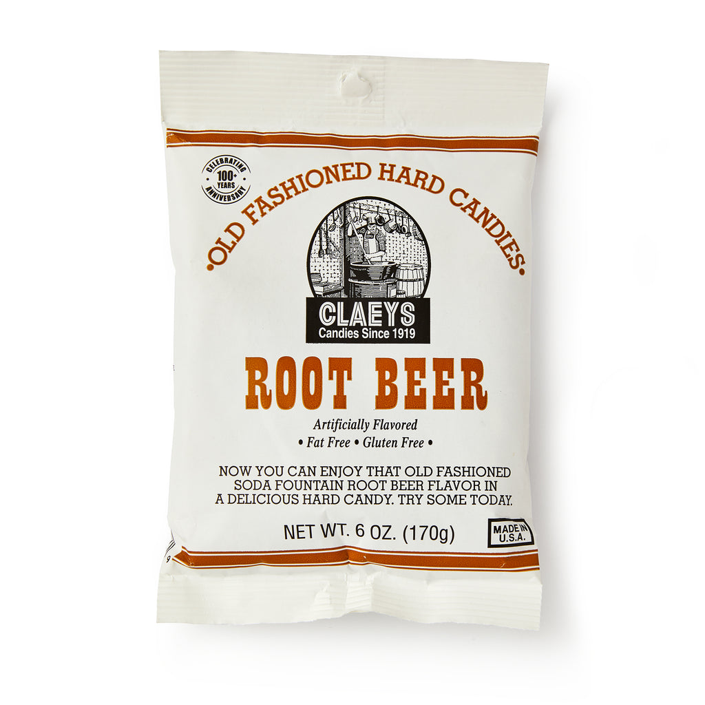 A white bag of Root Beer Old Fashioned Hard Candies features vintage-style text and a soda fountain illustration, evoking nostalgic root beer flavor. Fat free, gluten free, with a net weight of 6 oz (170g).
