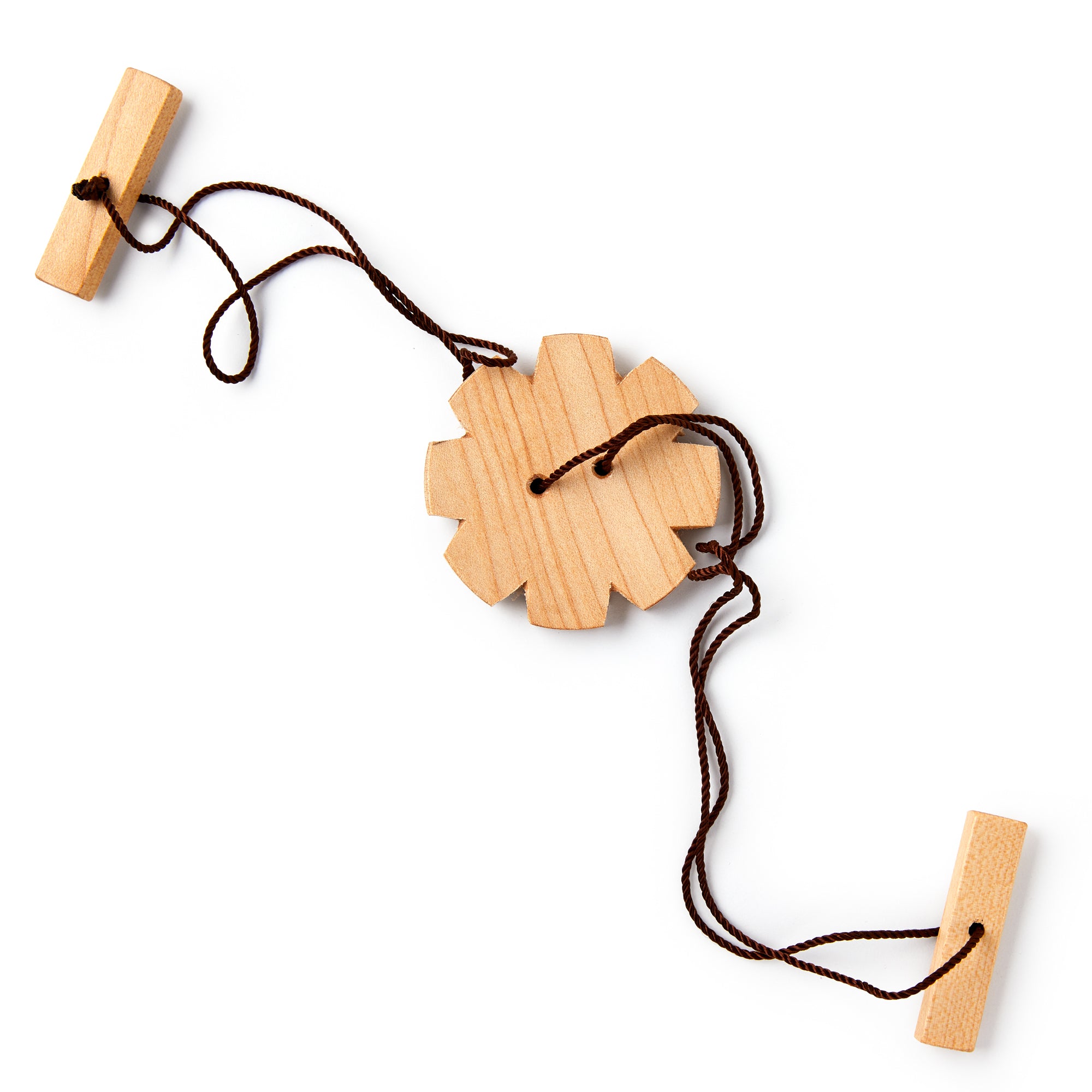 Wooden toy with a string on a white background