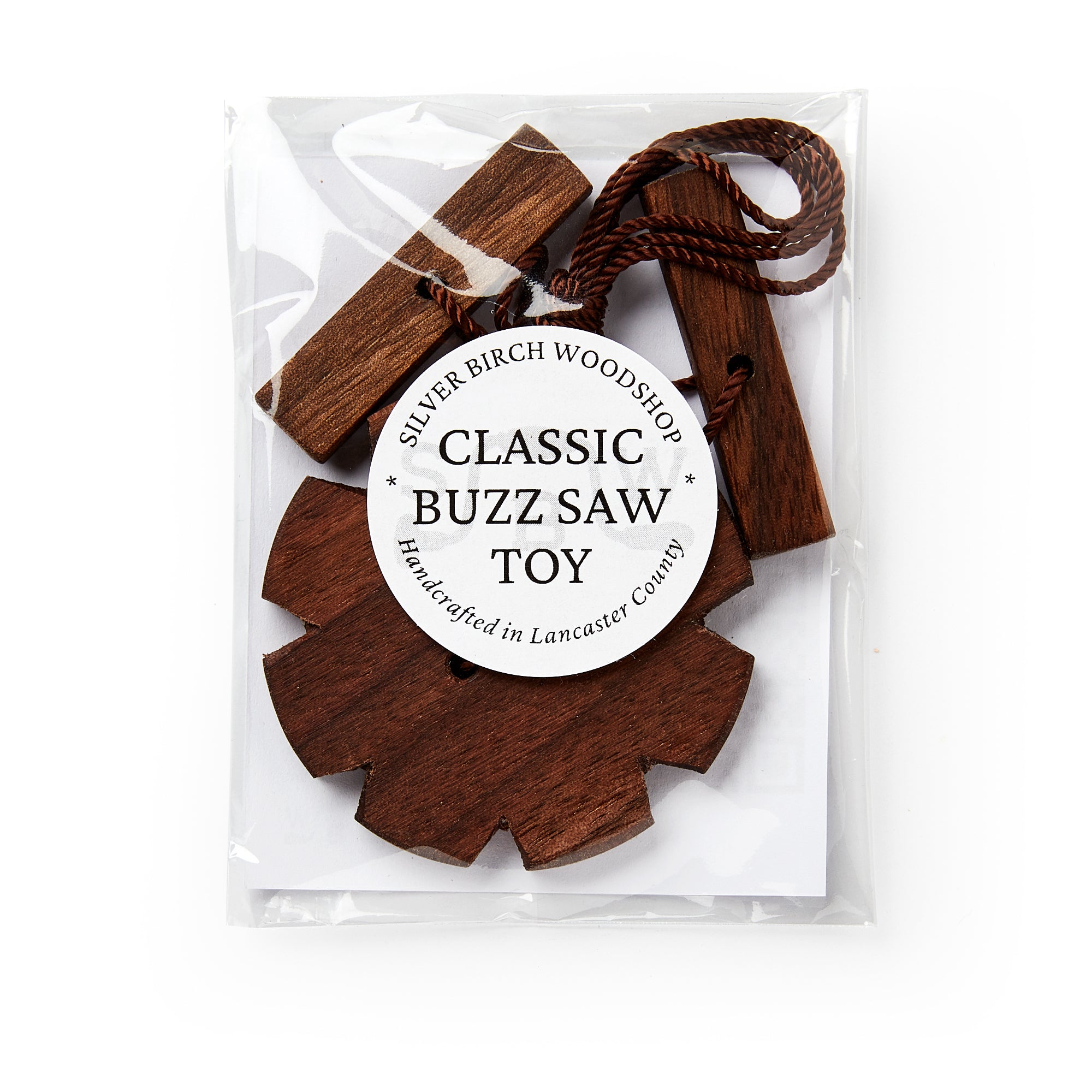 Wooden buzz saw toy in packaging with 'Silver Birch Woodshop' label on a white background