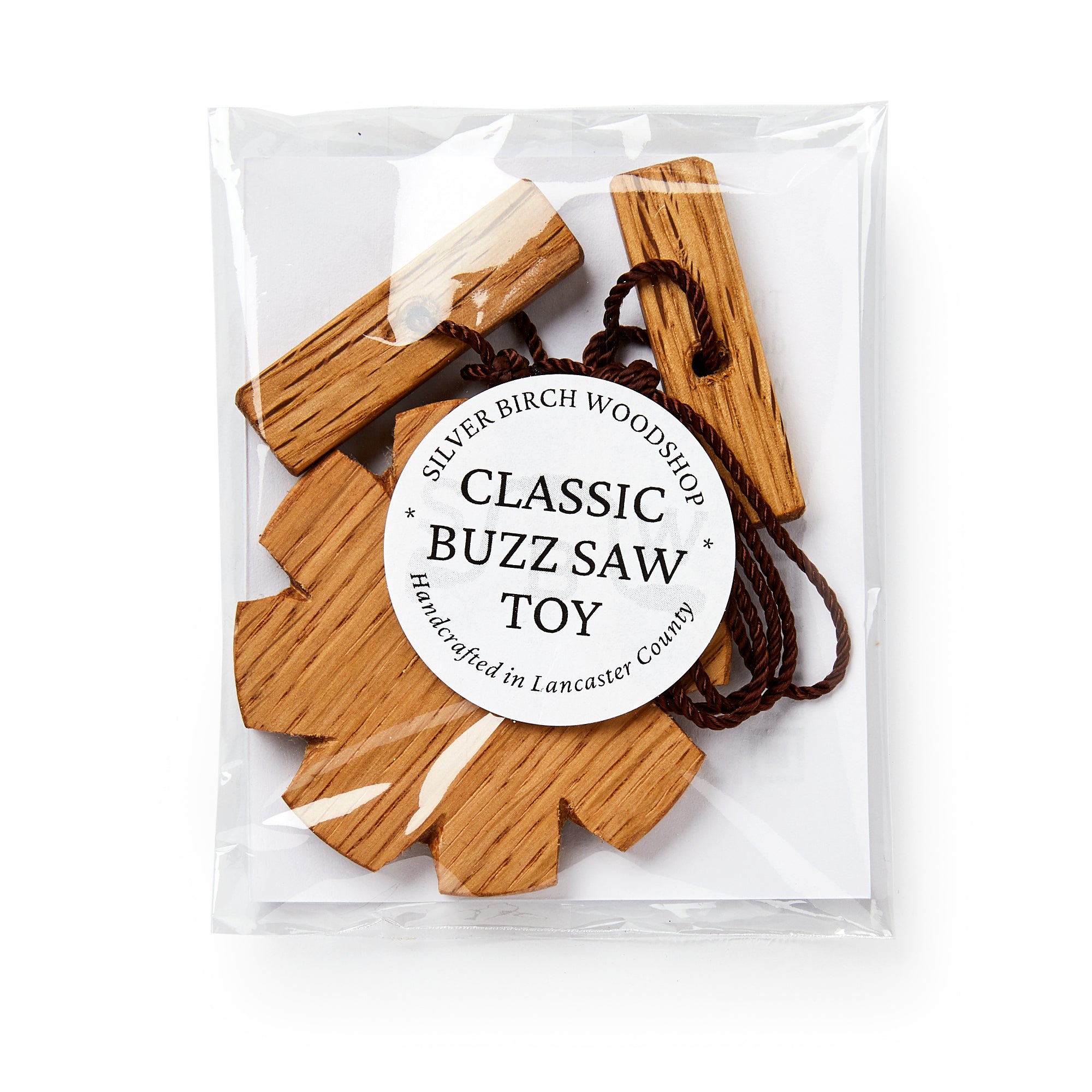 Wooden buzz saw toy in clear packaging with a label on a white background