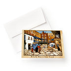 Colonial Taverns Note Cards feature a lively illustration of Black Horse Inn Yard with people, horse-drawn carts, and historic buildings; ideal for correspondence and includes an envelope.