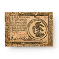 Inspired by the 1776 $3 Continental Congress bill, this Currency Fridge Magnet features ornate text, intricate borders, and a detailed eagle emblem—capturing iconic details from Philadelphia’s Revolutionary-era currency.