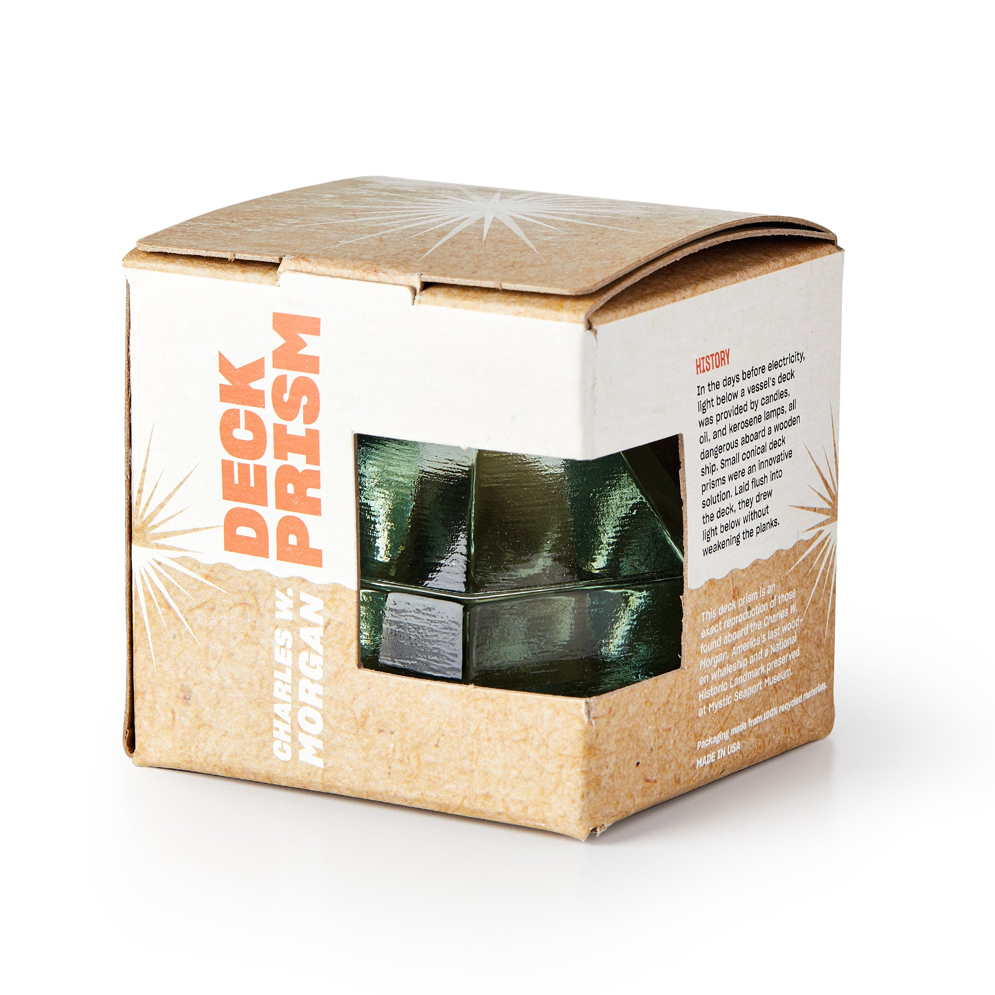 A Green Deck Prism, Small, peeks out from a brown box labeled “Deck Prism” and “Charles W. Morgan,” celebrating maritime heritage with a brief history printed on the side.