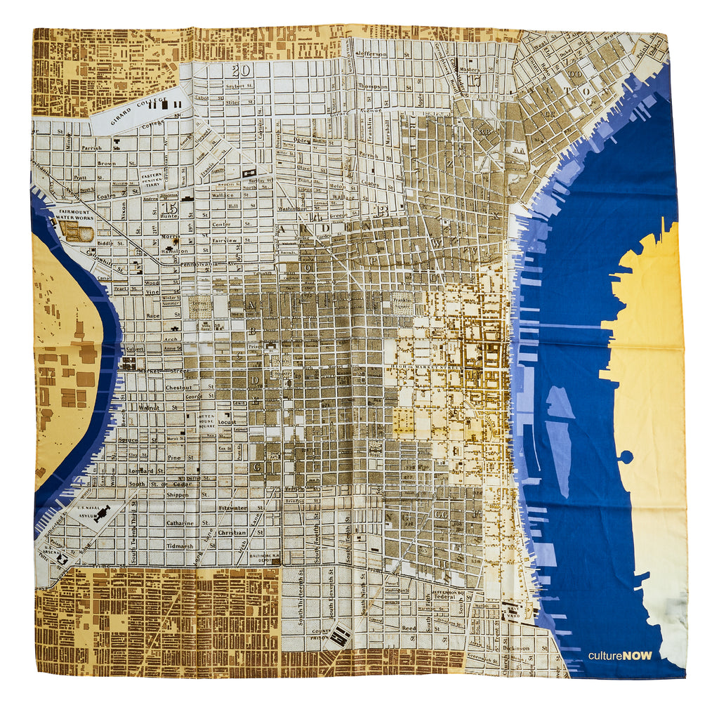 The Historic Philadelphia Then Scarf is a square silk scarf featuring a detailed street map of Philadelphia, inspired by historic maps, with city blocks and landmarks. "cultureNOW" is printed in the lower right corner.