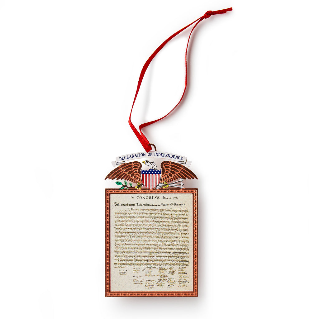 The Declaration Copper Ornament features the U.S. Declaration of Independence with an eagle and shield design, hanging from a red ribbon.