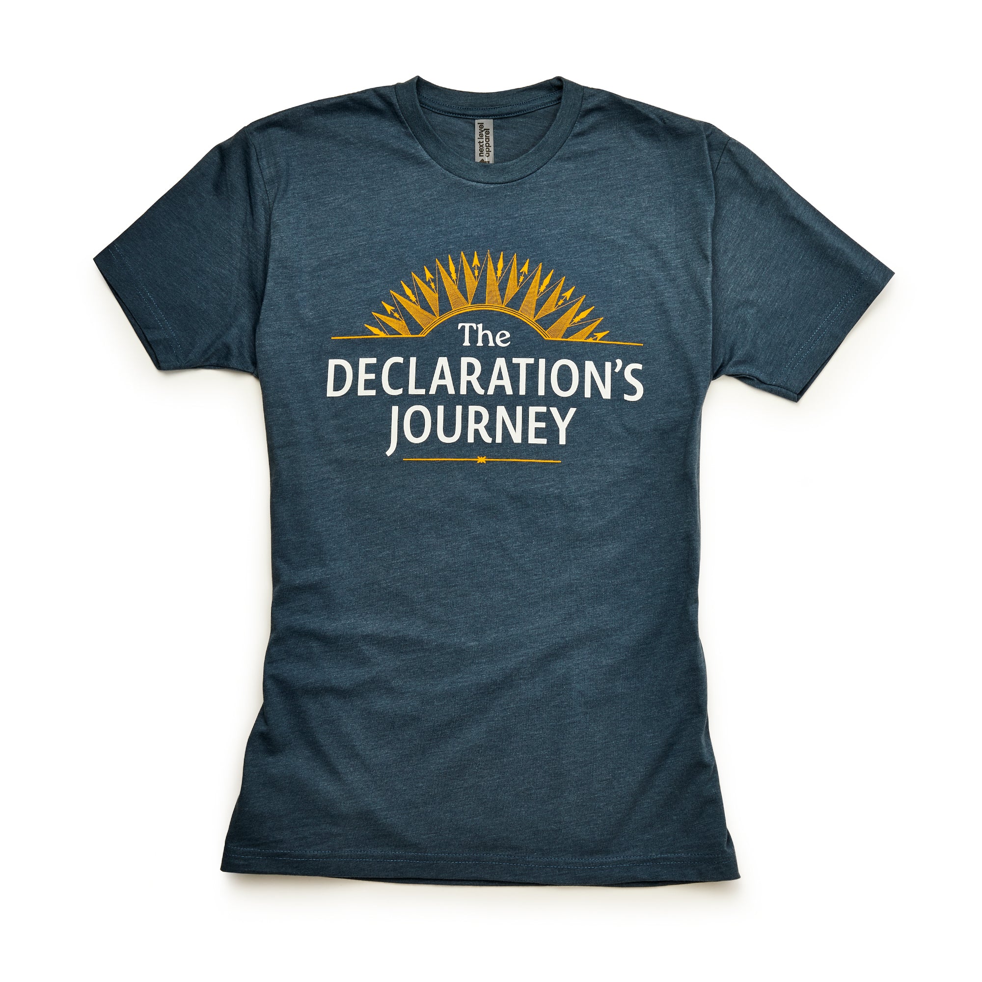 The Declaration's Journey T-Shirt features white "The Declaration’s Journey" text below a yellow sunburst on blue, displayed flat on white—ideal for commemorating the Declaration of Independence Semiquicentennial exhibition.