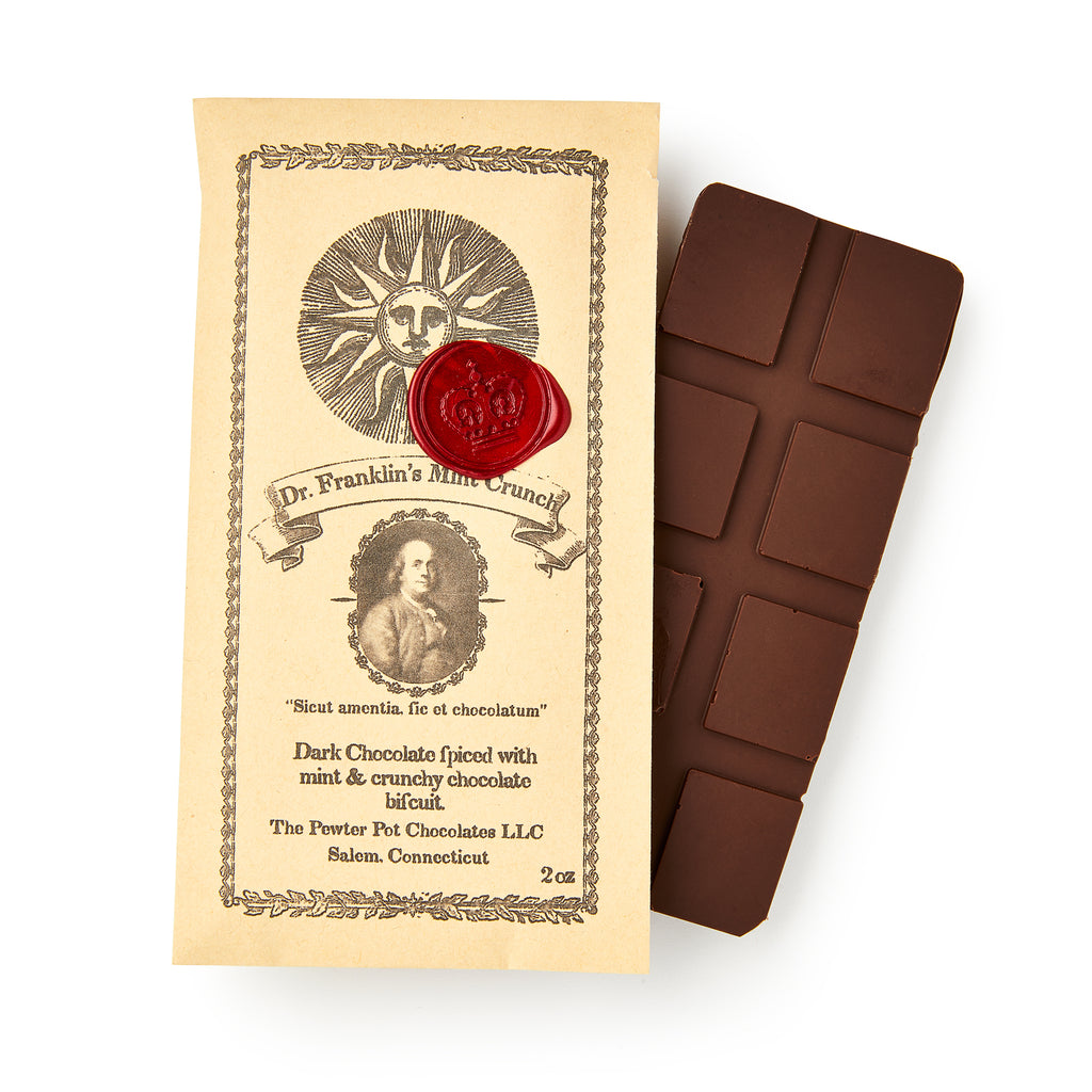 Dr. Franklin's Mint Crunch Chocolate Bar, wrapped in vintage-style packaging with an old-fashioned portrait, red wax seal, and decorative border, is a segmented dark chocolate bar infused with refreshing mint oil.