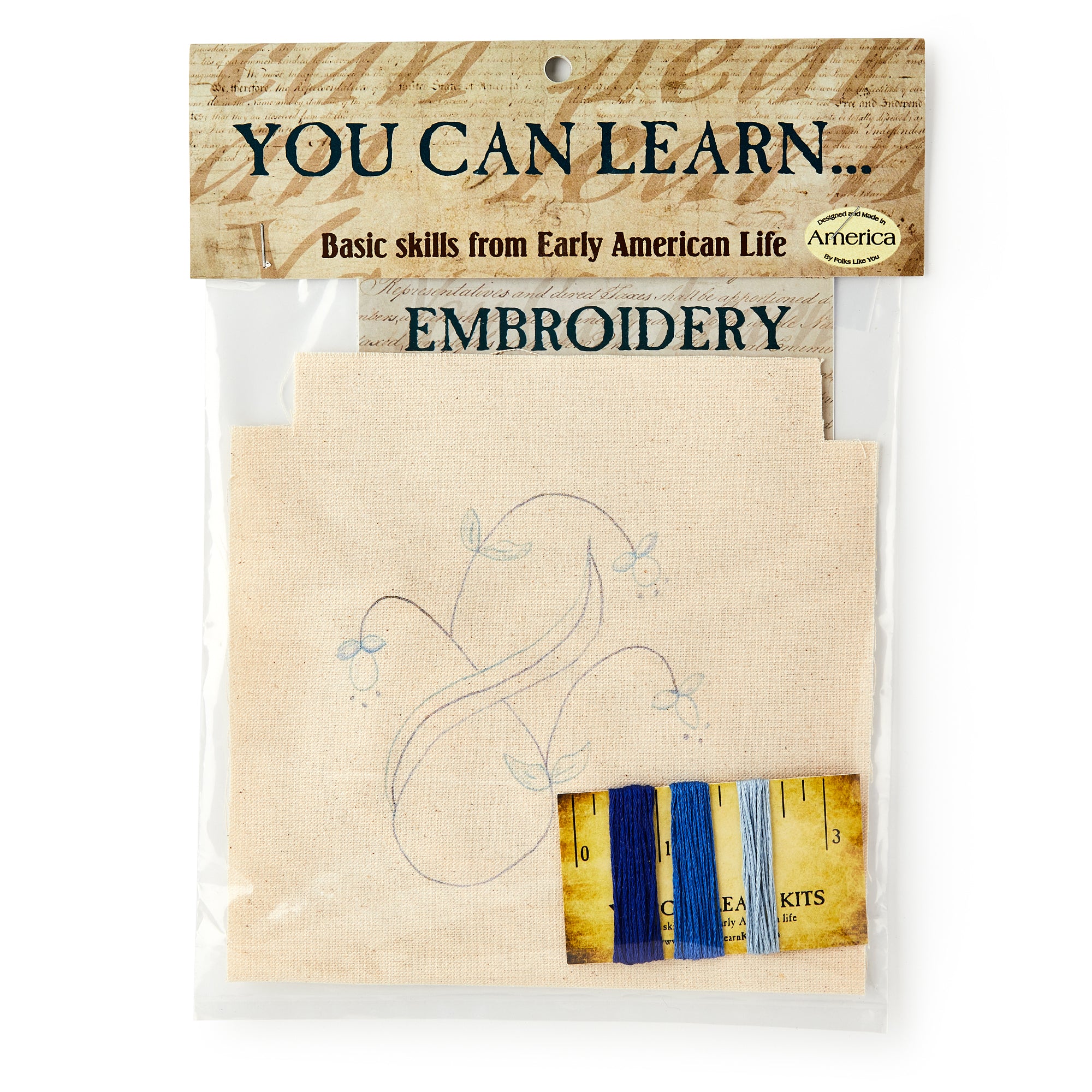 The Embroidery Kit comes in a plastic bag labeled "You Can Learn... Basic skills from Early American Life" and includes fabric with a floral outline plus four thread colors—ideal for beginners creating their first hand-stitched designs.
