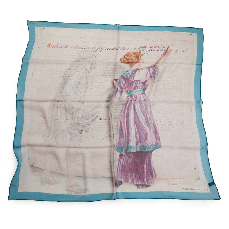 The All Equal Scarf is a chiffon silk accessory with a faint colonial-era figure and a woman in purple writing the Declaration of Independence, accented by cursive script and bordered in light blue.