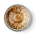 The GW Linked States Paperweight is round with an ornate "GW" monogram in the center, encircled by "Long live the president" in decorative script, and is shown from above on a white background.