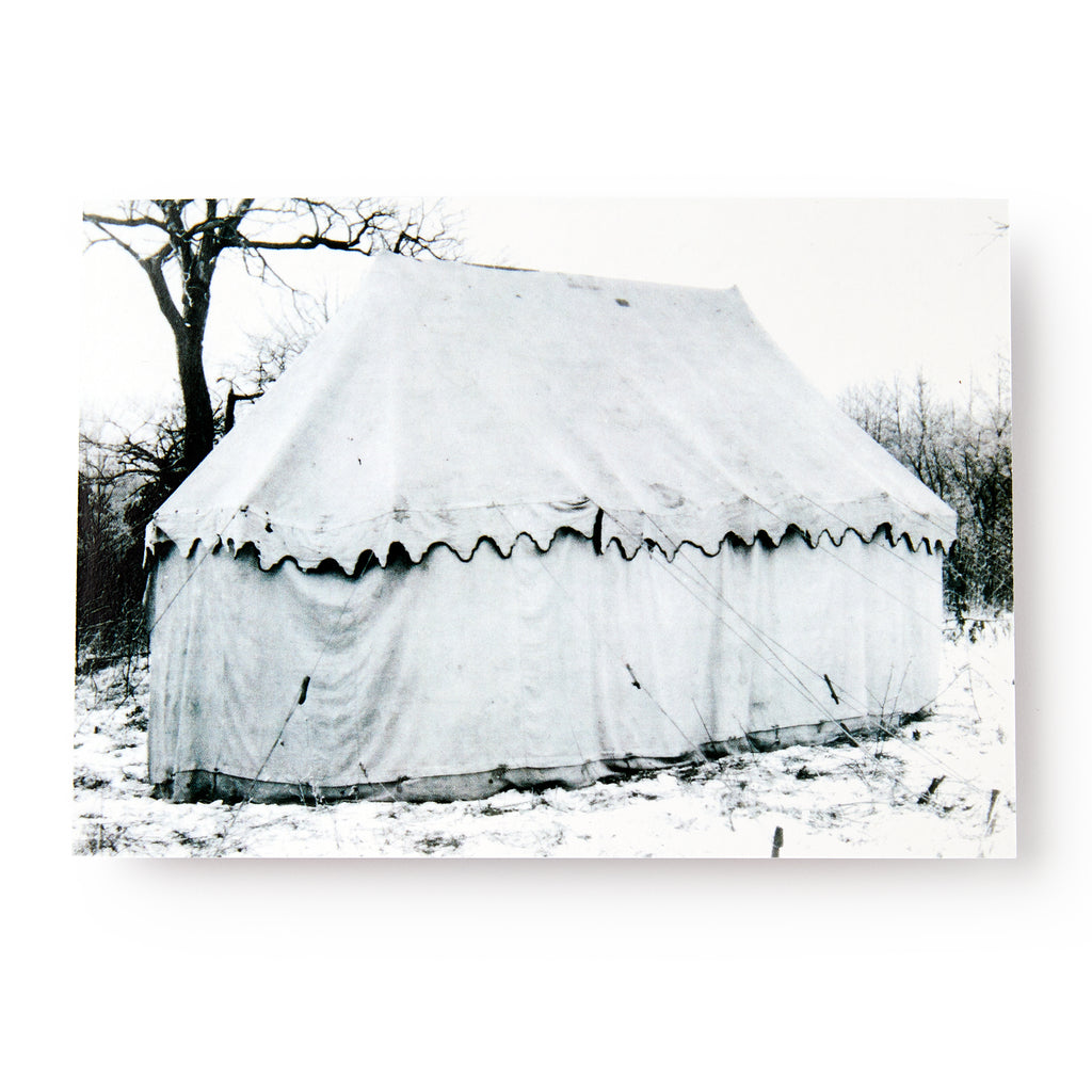 The George Washington Tent In Snow Postcard features a black and white photo of a large canvas tent set up in a snowy landscape, reminiscent of Revolutionary War encampments, with leafless trees and ropes anchoring the tent.