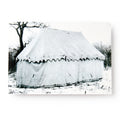 The George Washington Tent In Snow Postcard features a black and white photo of a large canvas tent set up in a snowy landscape, reminiscent of Revolutionary War encampments, with leafless trees and ropes anchoring the tent.