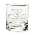 The George Washington Tent Whiskey Glass features a clear glass design engraved with a starry tent and cursive signature, reminiscent of classic Washington whiskey glasses, displayed empty against a white background.