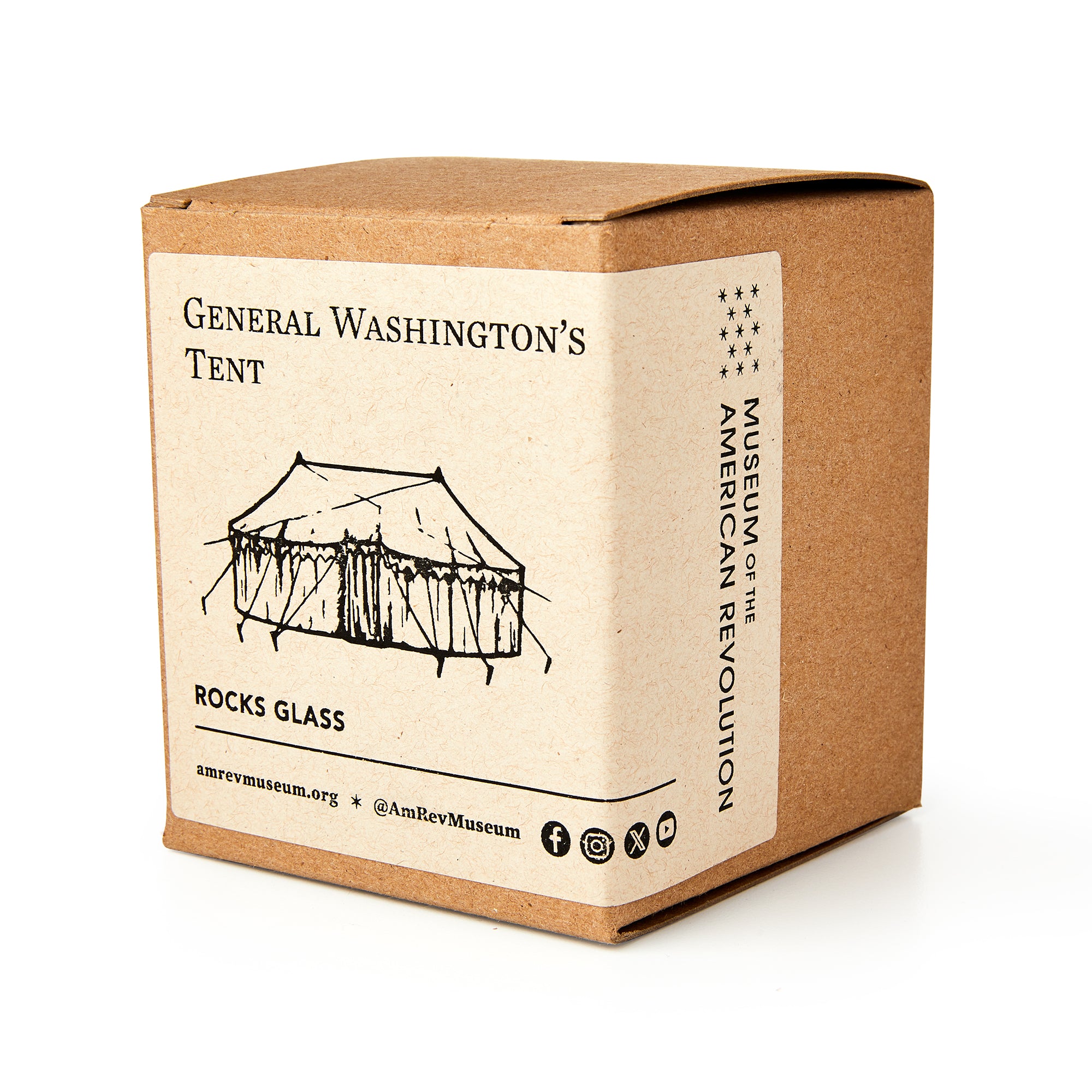 A brown box labeled George Washington Tent Whiskey Glass features a tent illustration, Museum of the American Revolution branding, and highlights its historical connection, containing a Revolutionary War-inspired glass.