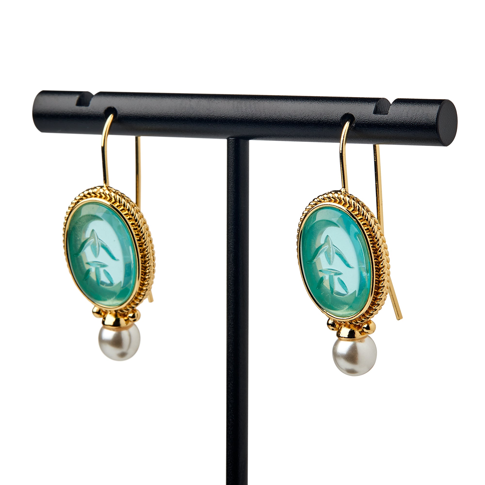 Glass Intaglio and Pearl Earrings, Teal—these elegant earrings feature oval teal glass intaglios and dangling pearls, inspired by colonial-era jewelry, displayed on a black T-shaped stand with gold-plated earwires.