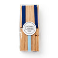 This classic Jacob’s Ladder folk toy features blue ribbons and is handcrafted in Lancaster County by Silver Birch Woodshop. It comes in clear plastic packaging with a round label reading “Jacob’s Ladder Toy, Handcrafted in Lancaster County.