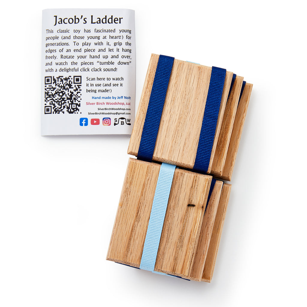 Jacob's Ladder, the classic wooden folk toy with blue and light blue ribbons, rests beside an instruction card featuring a QR code and social media icons for quick access to play tips.