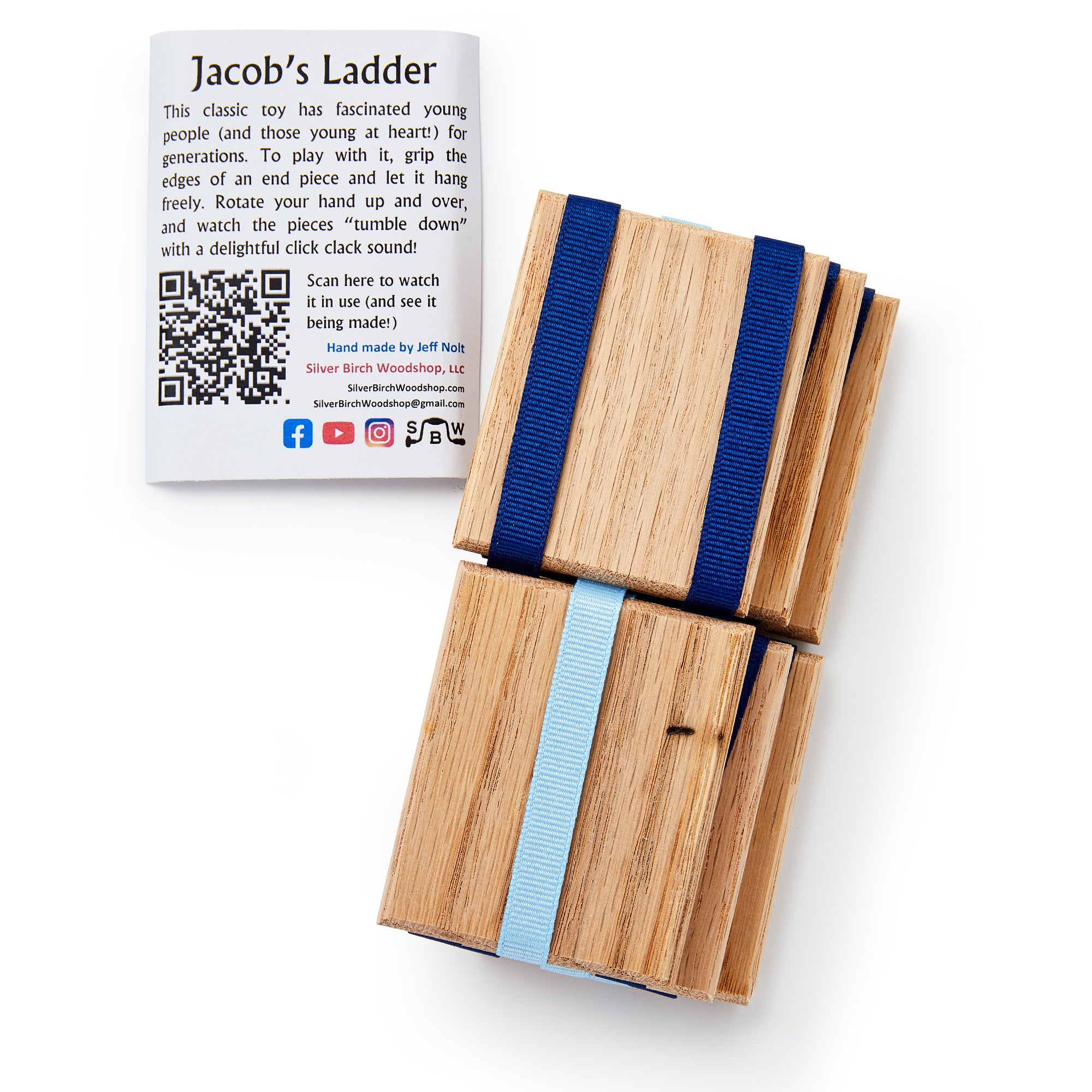 Jacob's Ladder, the classic wooden folk toy with blue and light blue ribbons, rests beside an instruction card featuring a QR code and social media icons for quick access to play tips.