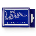 The Join, or Die Playing Cards come in a blue rectangular box featuring a white segmented snake illustration with colonies’ abbreviations and the phrase "JOIN or DIE," inspired by a famous colonial America cartoon—perfect for card enthusiasts.