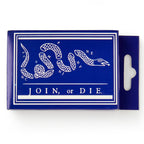 The Join, or Die Playing Cards come in a blue rectangular box featuring a white segmented snake illustration with colonies’ abbreviations and the phrase "JOIN or DIE," inspired by a famous colonial America cartoon—perfect for card enthusiasts.