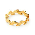 The Laurel Leaf Ring is crafted in gold vermeil with an interlocking leaf pattern encircling the band, offering an elegant symbolic design displayed on a plain white background.