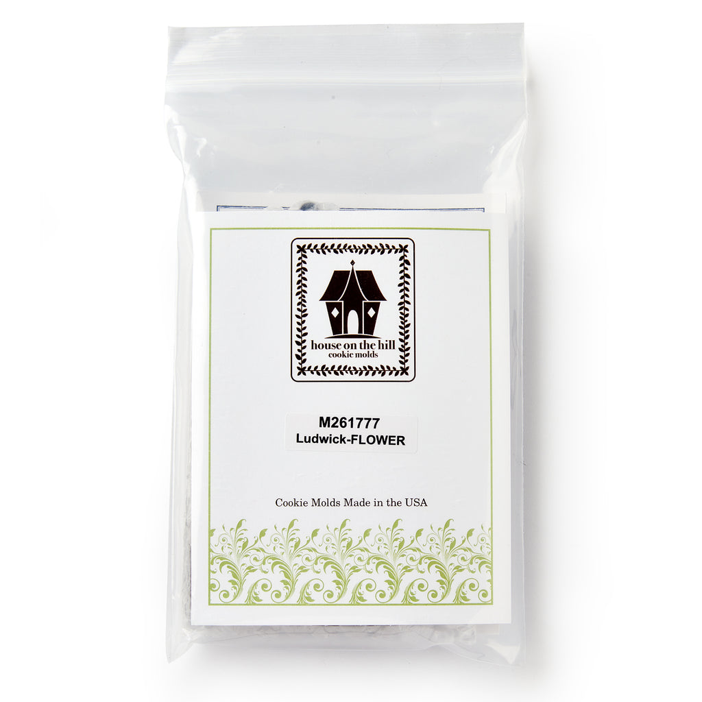 A clear resealable bag holds a House on the Hill Christopher Ludwick Gingerbread Mold, Small, Flower, with decorative borders. Features colonial American design cookie mold. Made in the USA.
