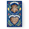 A blue box labeled “Christopher Ludwick Gingerbread Cookie,” with colorful floral designs and cookie windows shaped like a person and a heart, celebrates 18th-century baking and Revolutionary history.