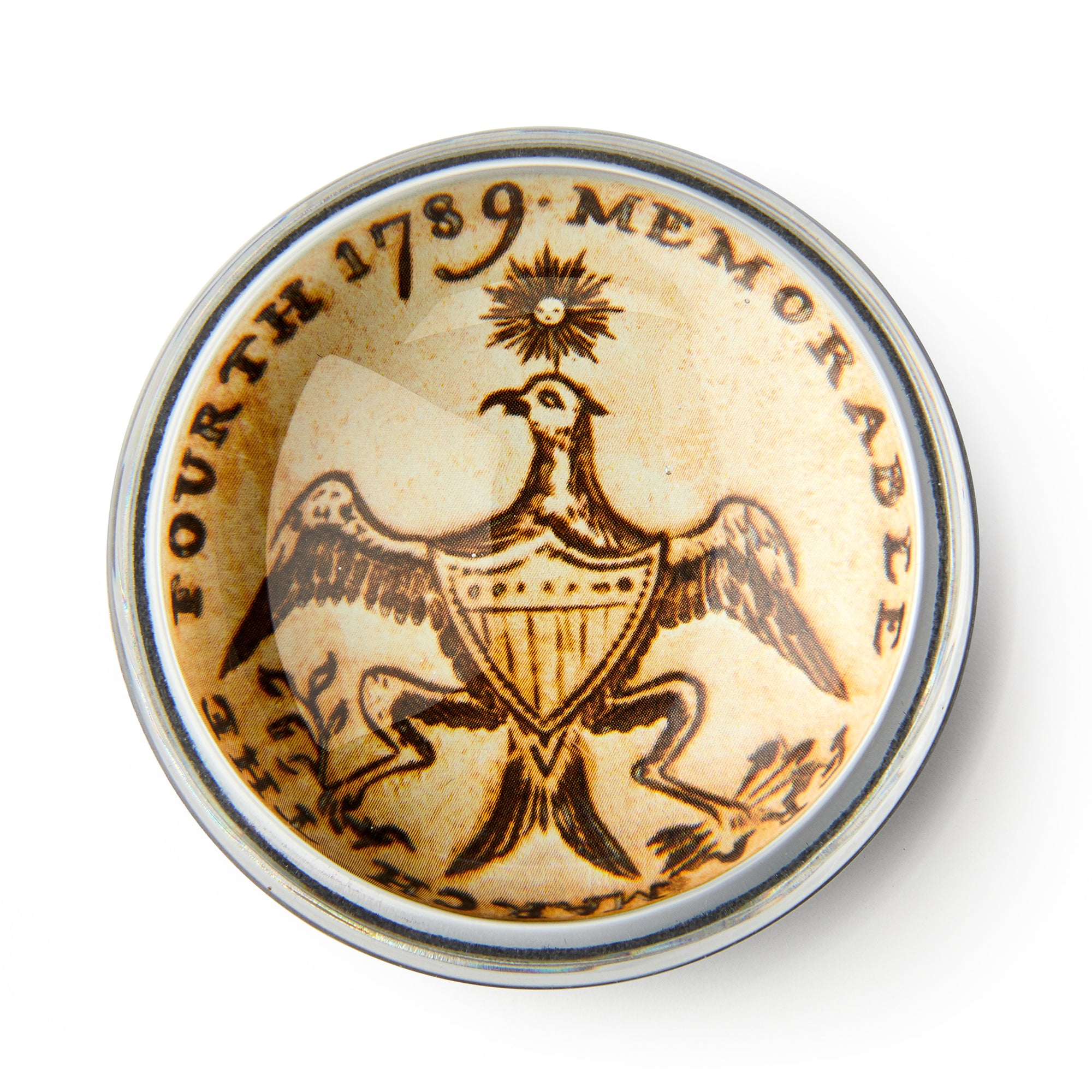 Round, vintage-style Memorable Era Paperweight features an eagle with a shield and radiant star—resembling an inaugural coin. "THE FOURTH 1789 MEMORABLE" circles its cream, sepia-engraved background—a unique American history desk accessory.