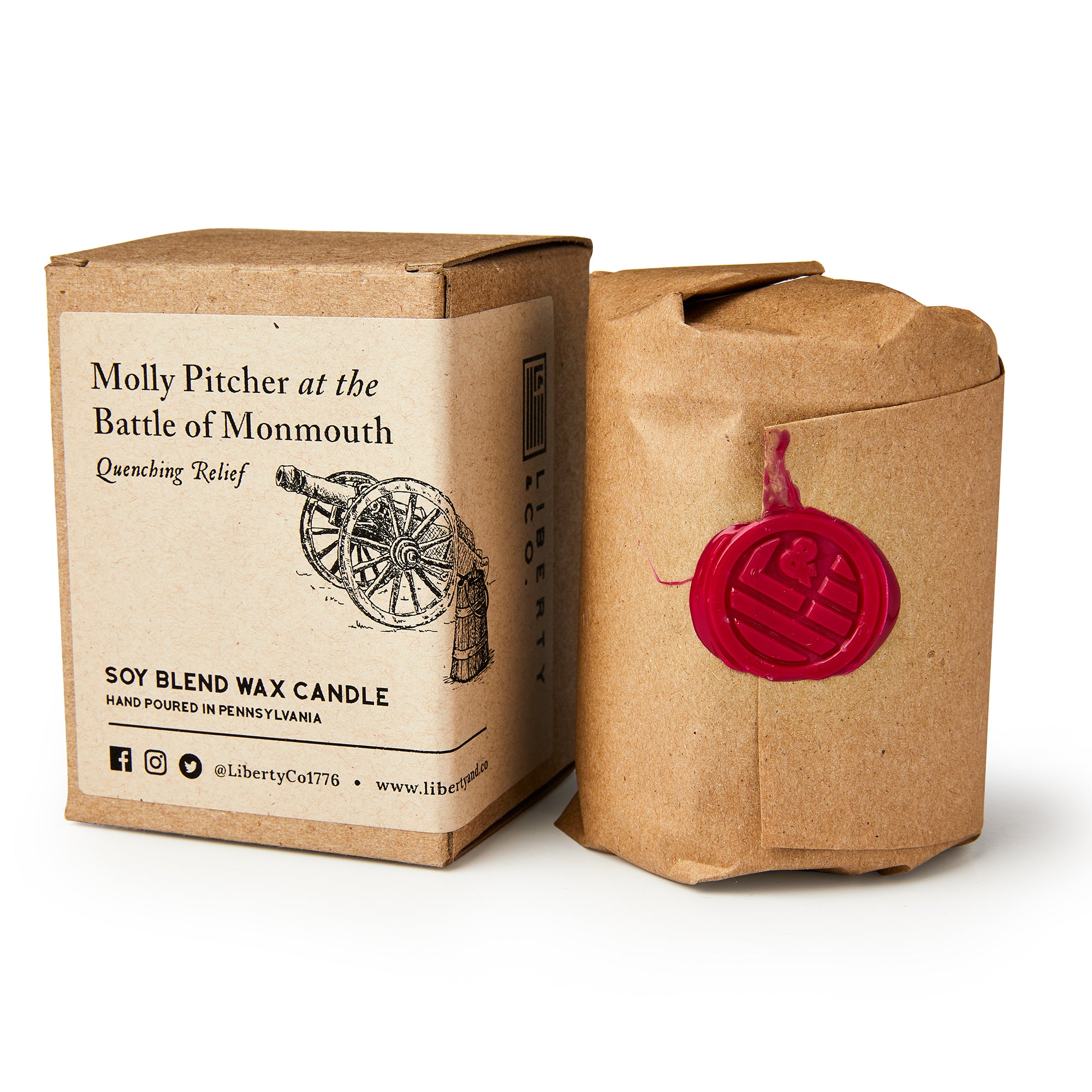 The Molly Pitcher Candle is a hand-poured soy candle wrapped in brown paper with a red wax seal, packaged in a box labeled “Molly Pitcher at the Battle of Monmouth—Quenching Relief” and adorned with a cannon to honor this heroine.