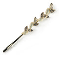 The Opaline Rhinestone Barrette is a decorative gold hairpin with alternating leaf designs featuring shiny crystals and opaline rhinestones, offering an elegant touch of sparkle to your hairstyle.