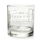 The Join or Die Whiskey Glass is a clear tumbler inspired by American history, featuring vintage-style printed text, decorative flourishes, old-fashioned fonts and numbers—evoking Benjamin Franklin’s era.