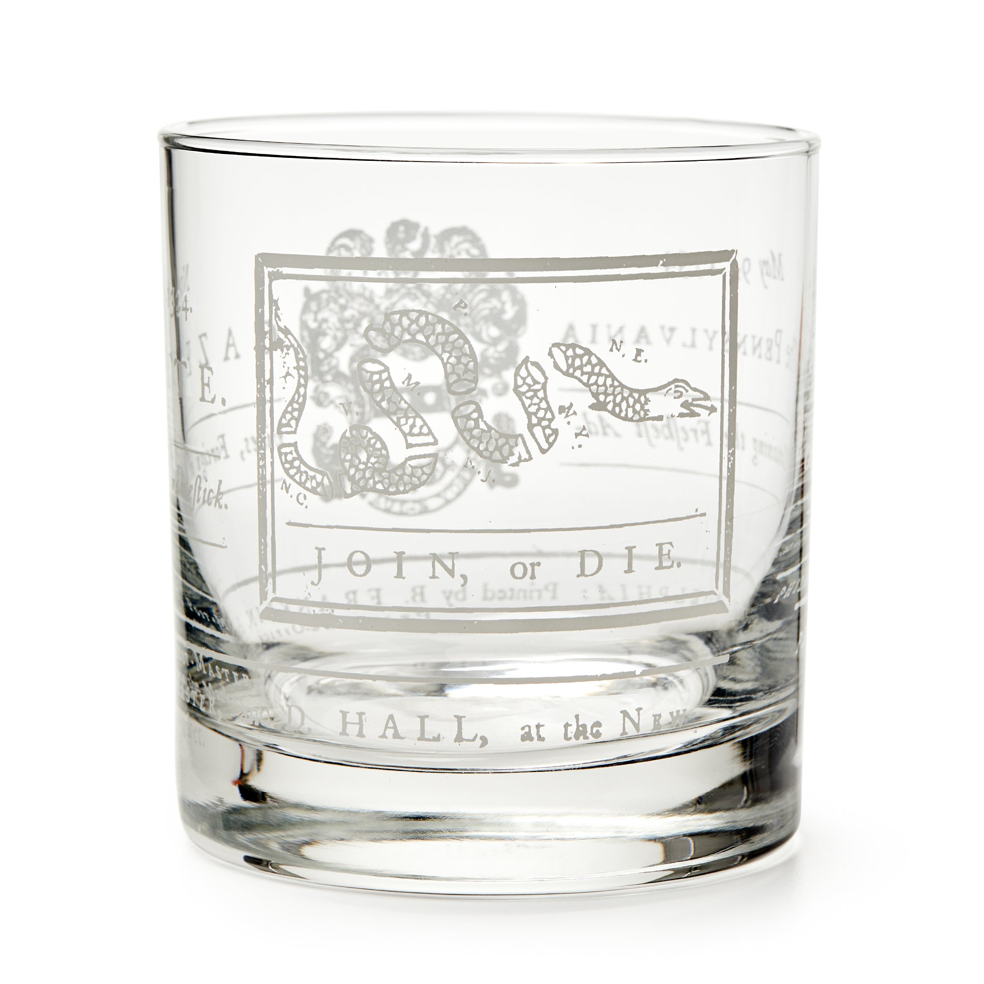 The Join or Die Whiskey Glass features an etched segmented snake and the words JOIN, or DIE beneath it, inspired by Benjamin Franklin's iconic American history design.