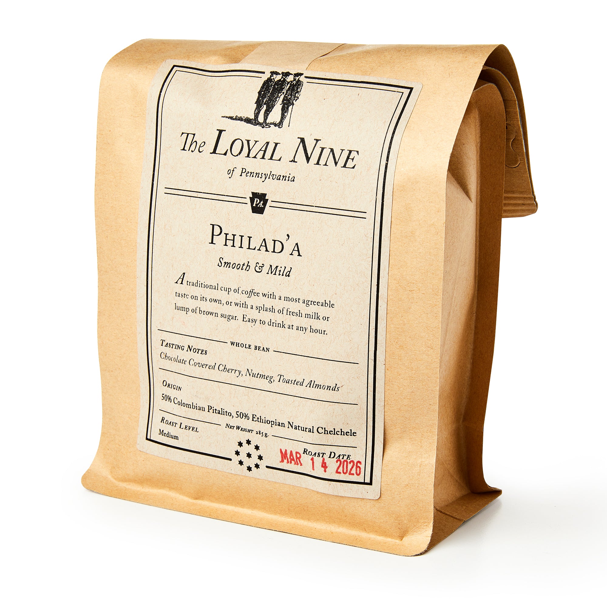 A brown paper bag of Philad'a Whole Bean Coffee, medium roast whole beans labeled “Philad’a Smooth & Mild” with tasting notes and a 03/14/2026 expiration date, stands upright—a tribute to classic Philadelphia coffeehouse tradition.