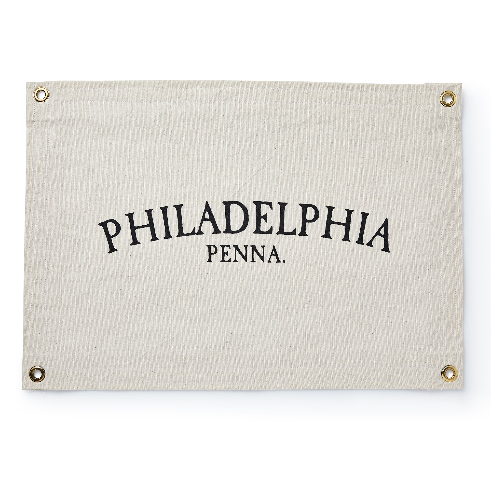 The Philadelphia Canvas Banner is a cream-colored rectangular flag with metal grommets in each corner and bold black arched “PHILADELPHIA PENNA.” text.
