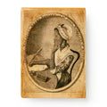 The Phillis Wheatley Fridge Magnet features a sepia illustration of the African American poet in a bonnet and dress, seated at a table with quill and papers, framed in an oval—just like the image at the Museum of the American Revolution.