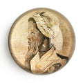 The Phillis Wheatley Glass Paperweight features a sepia-toned, vintage-style profile illustration of the African American poet with a headscarf, resting her chin on her hand against a plain white background.
