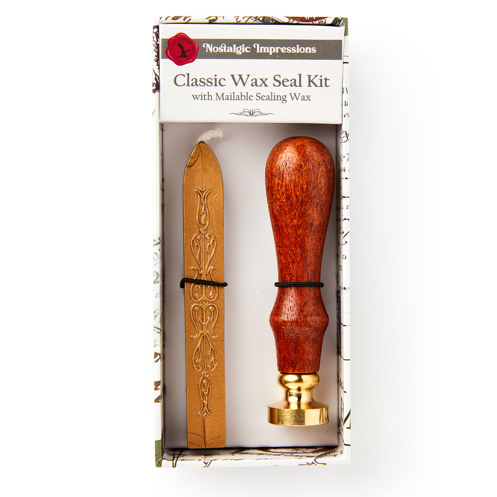 The Rosewood Handle Wax Seal Stamp Kit with Sealing Wax comes boxed and includes a rosewood handle brass seal and a stick of gold sealing wax. The label reads Rosewood Handle Wax Seal Stamp Kit with Sealing Wax.