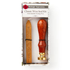 The Rosewood Handle Wax Seal Stamp Kit with Sealing Wax comes boxed and includes a rosewood handle brass seal and a stick of gold sealing wax. The label reads Rosewood Handle Wax Seal Stamp Kit with Sealing Wax.