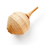 The Wooden Top is a handcrafted colonial toy with a smooth, natural finish and visible wood grain, shown against a white background.