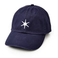 The Star Cap is a navy cotton twill hat with a white, six-pointed embroidered star on the front, inspired by George Washington’s classic star hat and shown against a plain white background.