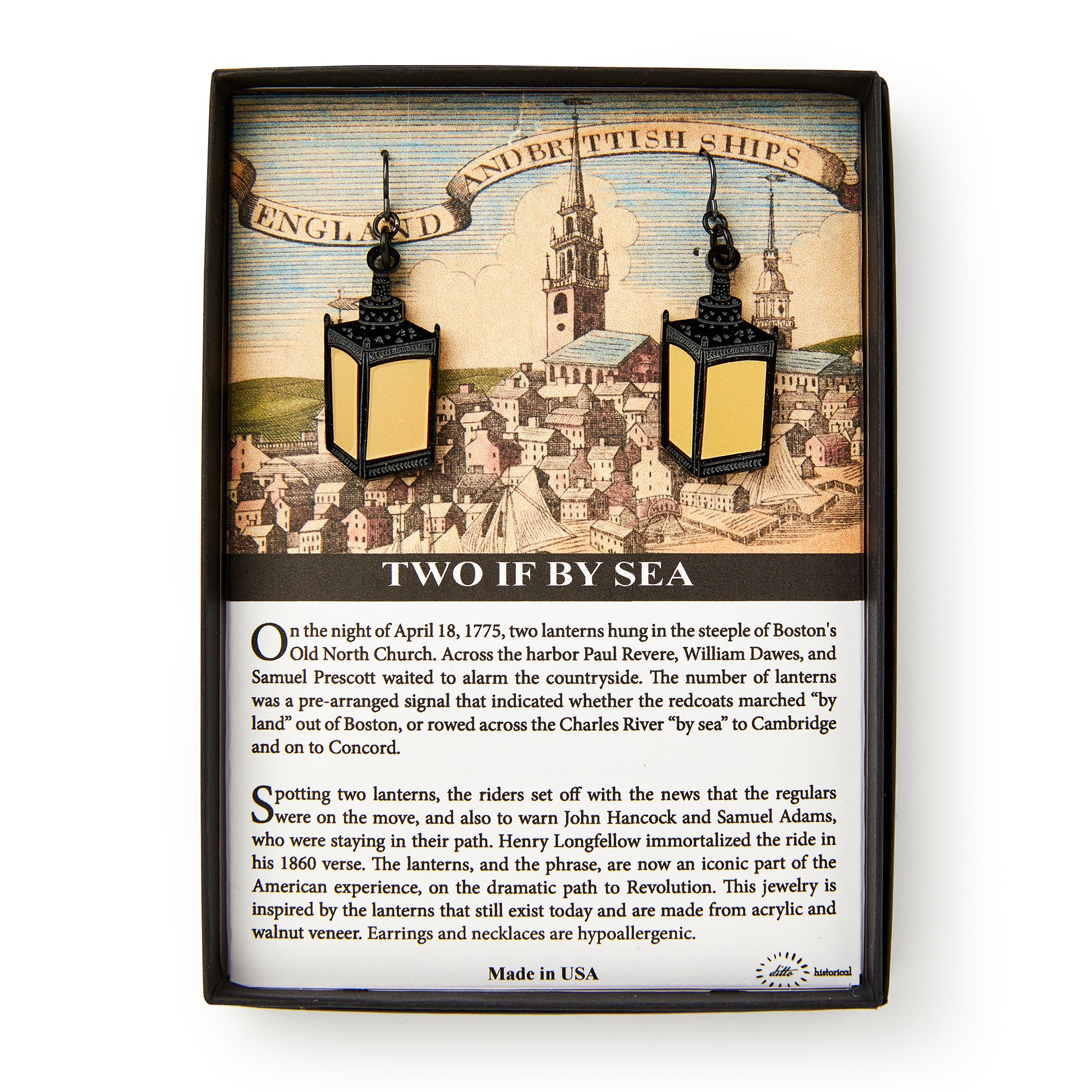 Two if by Sea Earrings: Lantern-shaped, hypoallergenic earrings in a gift box, showcasing historic Boston artwork and telling the story of Paul Revere’s Revolutionary War ride. Perfect for history enthusiasts.