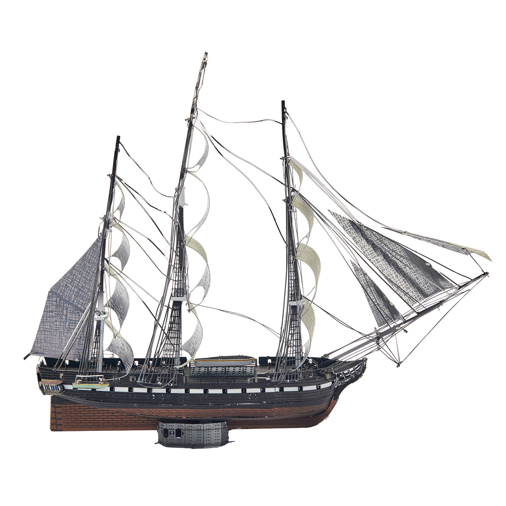 Model of a three-masted sailing ship on a white background