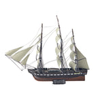 Model of a three-masted sailing ship with white sails on a white background
