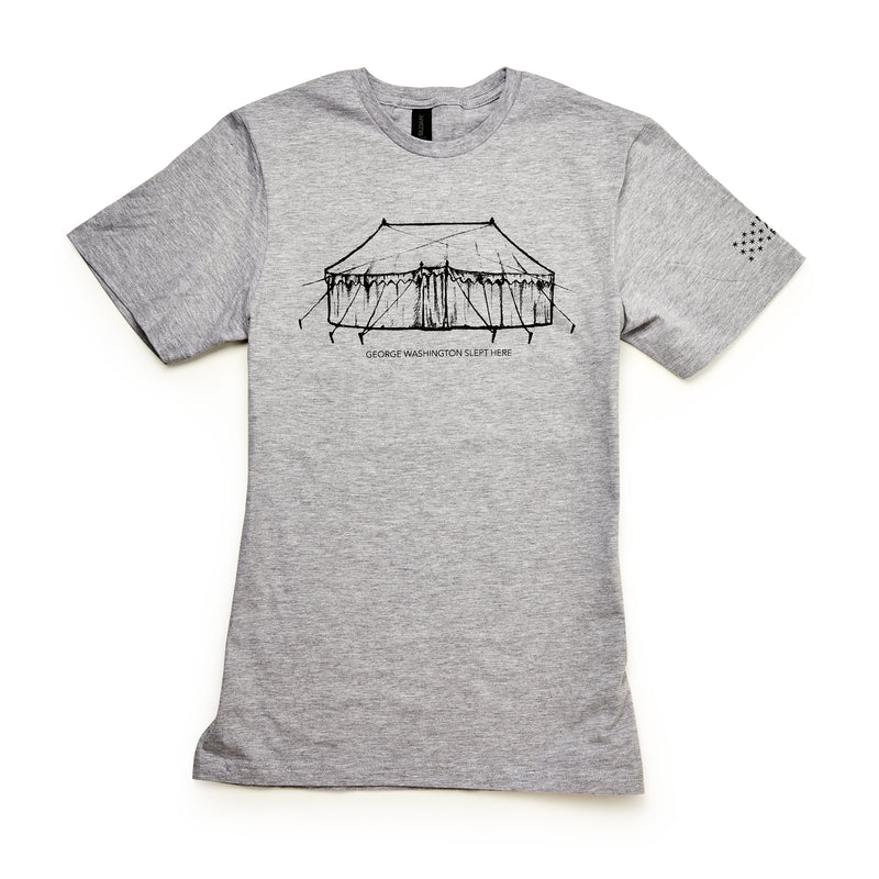 The "George Washington Slept Here" T-Shirt is light gray with a black line drawing of a colonial tent and the phrase below. Small stars on the left sleeve add detail to this unique history-themed shirt.