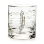 A clear glass tumbler with "We The People" etched in cursive, this Constitution whiskey glass is a thoughtful gift for history lovers and Revolutionary War enthusiasts.