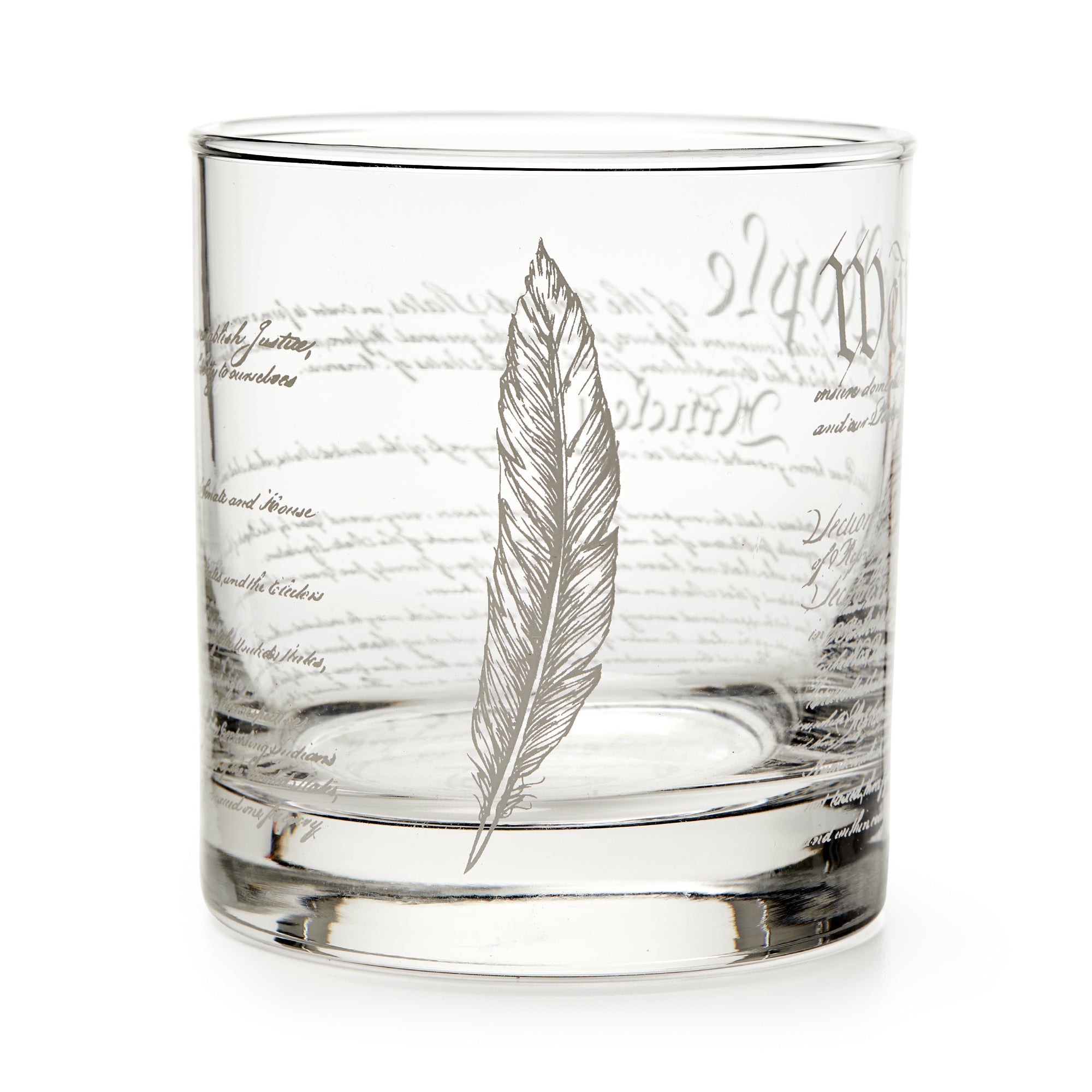 A clear glass tumbler with "We The People" etched in cursive, this Constitution whiskey glass is a thoughtful gift for history lovers and Revolutionary War enthusiasts.