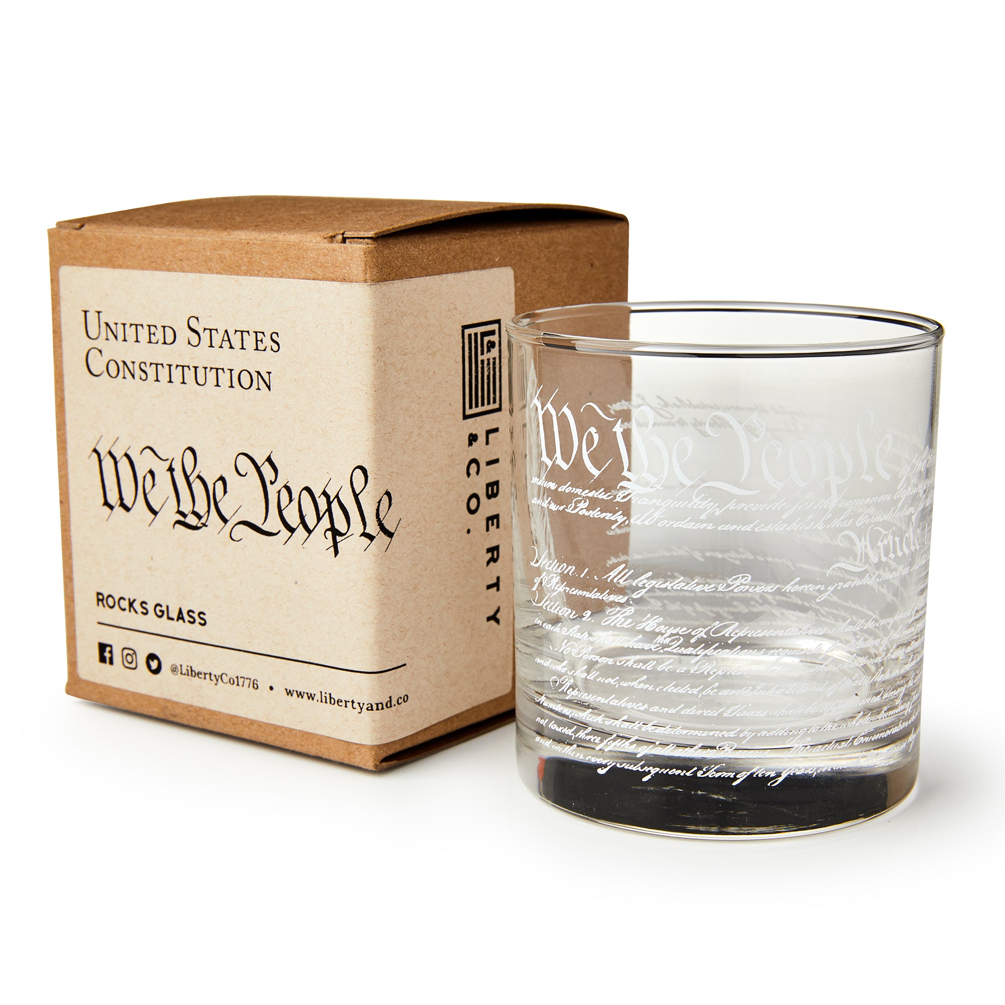 The We The People Whiskey Glass features the Constitution’s preamble elegantly etched on clear glass and comes in a brown box labeled United States Constitution by Liberty Glass Co.—a perfect gift for history buffs.