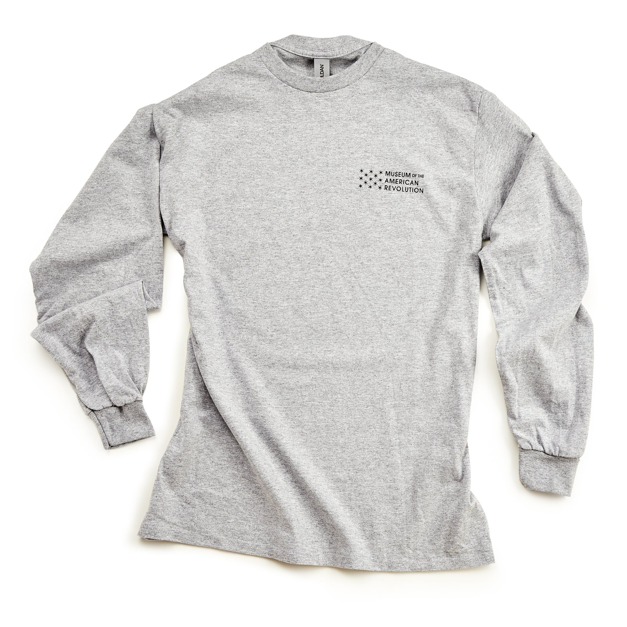 The Chain of States Long Sleeve T-Shirt is light gray with the Museum of the American Revolution logo in black on the upper left chest. It features a crew neck and ribbed cuffs—perfect for history enthusiasts.
